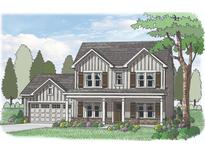 Charming two-story home with a welcoming front porch and traditional design elements at 1276 Cherry Bark Ct, Loganville, GA 30052