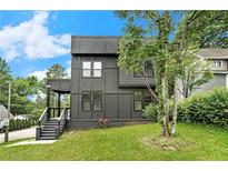 Modern two-story home featuring sleek lines and ample windows for natural light at 3139 Alston Dr, Decatur, GA 30032