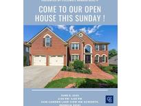 Real estate flyer promoting an open house for a brick home with a two-car garage and landscaped front yard at 2436 Camden Lake Nw Vw, Acworth, GA 30101