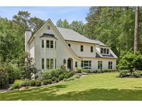 Stunning traditional style home with a well manicured front yard and professional landscaping at 520 Flying Scot Way, Alpharetta, GA 30005