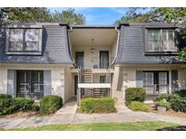 Charming condo exterior showcasing well-maintained landscaping and a welcoming entrance at 133 Maison Nw Pl, Atlanta, GA 30327