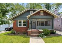 Charming two-story home with a blend of brick and siding, a manicured lawn, and inviting curb appeal at 509 Rankin Ne St, Atlanta, GA 30308