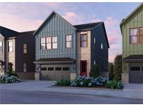 Charming two-story home with blue siding, brick accents, and a front-facing garage at 4011 Chamblee Dunwoody Rd, Chamblee, GA 30341