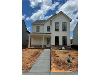 Charming two-story home with white siding, black framed windows, and a welcoming front porch at 3482 Adler Trl, Buford, GA 30519