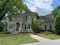 Elegant two-story home with a charming balcony and well-manicured lawn at 2038 Lee Se Rd, Smyrna, GA 30080