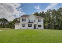 Beautiful two-story white home with black shutters, set on a large manicured lawn at 133 Prescott Manor Dr, Canton, GA 30115