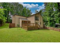 Spacious backyard with a wooden deck perfect for entertaining and outdoor enjoyment at 2926 Swarthmore Dr, Lawrenceville, GA 30044