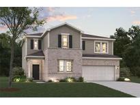 Charming two-story home with a brick and siding exterior, lush lawn, and a two-car garage at 7127 Brushwood Bend (Lot 44), Lithonia, GA 30058