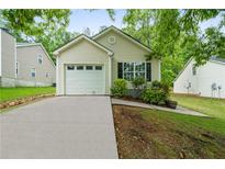Charming single-Gathering home featuring a well-maintained yard and attached garage at 1031 Abercorn Way, Douglasville, GA 30134