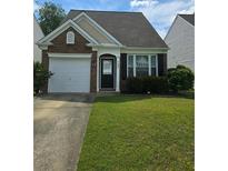 Charming single-Gathering home with a manicured lawn, garage, and well-maintained landscaping at 1692 Woodsford Nw Rd, Kennesaw, GA 30152