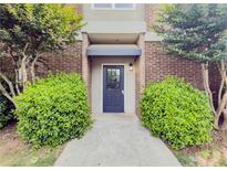 Welcoming front entrance features a solid blue door and manicured landscaping at 3301 Henderson Mill Rd # D3, Atlanta, GA 30341