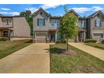 Charming townhome with well-manicured lawn, inviting curb appeal, and convenient garage access at 255 Skipjack Ct, Covington, GA 30016