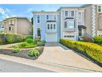 Charming townhome with attached garage, landscaped front yard, and welcoming curb appeal at 3688 E Bay St, Duluth, GA 30096