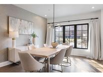 Elegant dining room with natural light, modern light fixture, designer decor, and stylish furniture at 726 Edgewood Ne Ave, Atlanta, GA 30307