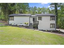Charming exterior with a well-manicured lawn, stylish siding, and welcoming front entry at 1819 Laurel Ridge Sw Dr, Conyers, GA 30094
