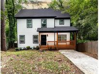 Charming two-story home with a welcoming front porch and a well-maintained yard at 398 Nw Wester Blvd, Atlanta, GA 30314