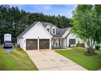 Charming two-story home with a well-manicured lawn and inviting front porch at 51 Norton Ave, Acworth, GA 30101