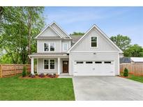 Charming two-story home with a well-manicured lawn and a two car garage at 1701 Aircraft S Dr, Marietta, GA 30060
