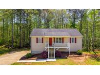 Charming single-Gathering home with inviting front porch and landscaped yard, perfect for relaxed living at 379 Villa Rosa Way, Temple, GA 30179