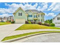 Charming two-story home with a well-manicured lawn, attached garage and inviting curb appeal at 2727 Lost Mill Trce, Buford, GA 30519