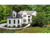 Inviting traditional two-story home with manicured lawn and detailed architectural design at 1358 Peppergrass Nw Trl, Acworth, GA 30101