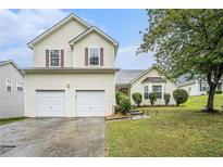 Charming two-story home featuring a two-car garage, well-maintained lawn, and attractive curb appeal at 436 Berkshire Pl, Fairburn, GA 30213