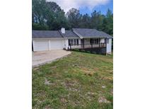 Charming home with a two-car garage and inviting deck at 129 Carolyn Path, Rockmart, GA 30153