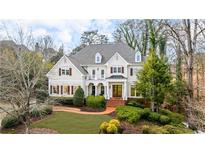 Beautiful two-story home featuring manicured landscaping, a brick walkway, and an inviting front entrance at 2616 Boddie Pl, Duluth, GA 30097