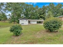 Charming single-story home with a well-maintained front yard and convenient carport at 1520 Oxford St, Douglasville, GA 30134