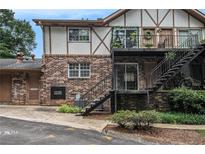 Well-maintained brick apartment building with Tudor accents, featuring balconies and staircases at 1225 Church St # A, Decatur, GA 30030