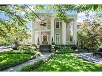 Stately home featuring elegant columns and a beautifully landscaped front yard at 908 N Highland Ne Ave, Atlanta, GA 30306