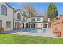 Stunning backyard pool and patio with brick accents create a luxurious outdoor living space at 228 Mount Vernon Dr, Decatur, GA 30030