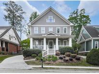 Charming two-story home featuring a welcoming front porch and beautifully landscaped front yard at 1110 Parkview Se Pl, Smyrna, GA 30080
