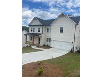 Charming two-story home with white siding, a black roof, and an attached two-car garage at 149 Silvercrest Dr, Acworth, GA 30101