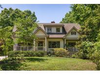 Charming craftsman-style home with a well-manicured lawn and inviting front porch at 164 Ridley Cir, Decatur, GA 30030