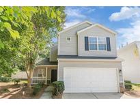 Charming two-story home with a two-car garage and well-manicured landscaping in a desirable neighborhood at 606 Windcroft Nw Cir, Acworth, GA 30101