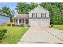 Charming two-story home with a well-maintained lawn and a two-car garage at 3315 Brookfield Dr, Austell, GA 30106