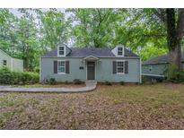 Charming single-story home with dormer windows and a cozy, inviting curb appeal at 3140 Delowe Dr, Atlanta, GA 30344