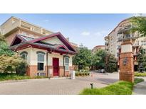 Gated entrance featuring brick accents and mature landscaping, offering privacy and security at 200 River Vista Dr # 436, Atlanta, GA 30339