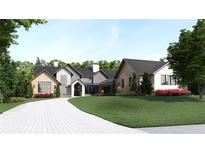 An inviting front view showcases the home's unique architecture and manicured landscaping at 250 Mayfield Rd, Alpharetta, GA 30009