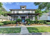 Charming two-story home with a welcoming front porch, neat landscaping and lovely curb appeal at 178 Mission Oak Dr, Grayson, GA 30017