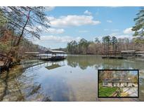 Idyllic lake view with private docks and serene surroundings, perfect for nature lovers at 3510 Riviera Dr, Cumming, GA 30041