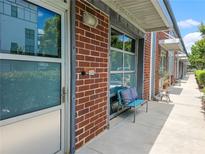 Charming brick exterior with a seating area, offering a cozy entrance and curb appeal at 1661 La France Ne St # 221, Atlanta, GA 30307