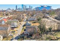 Charming neighborhood street view with Atlanta skyline and Mercedes Benz stadium in the background at 660 Delbridge Nw St, Atlanta, GA 30314