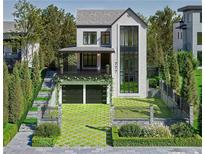 Stunning modern home features a landscaped front yard, two-car garage, and an elegant glass-enclosed entryway at 777 Brookridge Ne Dr, Atlanta, GA 30306