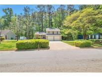 Charming two-story home with a manicured lawn and a spacious two-car garage at 5379 Winslow Xing, Lithonia, GA 30038