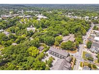 Expansive aerial view showcases property within a lush, green neighborhood and close to the downtown community at 963 Forrest St, Roswell, GA 30075