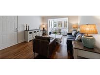 Inviting living room features wood floors, large windows and stylish furnishings for comfortable living and entertaining at 115 Peachtree Memorial Nw Dr # C1, Atlanta, GA 30309