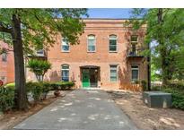 Brick exterior of building with mature landscaping and front walk way at 350 Peters Sw St # 6, Atlanta, GA 30313