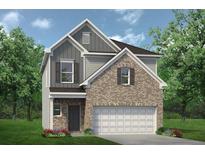 Charming two-story home featuring a brick facade, attached two-car garage, and a well-manicured front lawn at 1215 Elowen Dr, Austell, GA 30168
